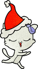 textured cartoon of a cat with bow on head wearing santa hat