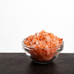 Fototapeta na wymiar Fine-grain pink Himalayan salt and crystals - Exotic cooking ingredient