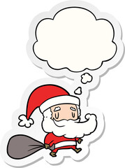cartoon santa claus with sack and thought bubble as a printed sticker