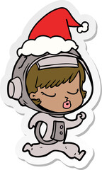 sticker cartoon of a pretty astronaut girl running wearing santa hat