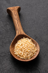 Organic sesame seeds in the spoon - Sesamum indicum