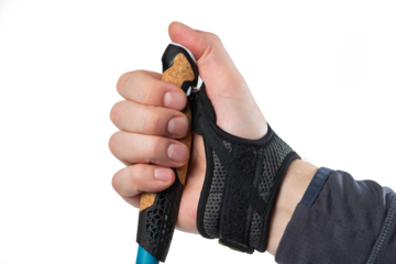 Hand with Nordic walking stick isolated on white background. A cane for Nordic walking in a man's hand close-up
