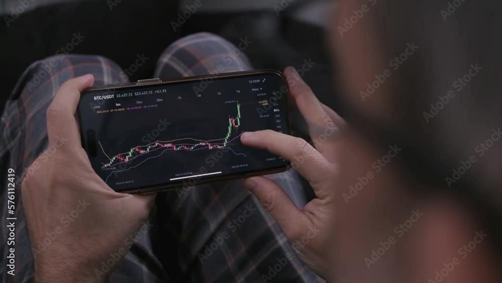 Aufkleber caucasian man at home trade and earn money on the cryptocurrency exchange online using his smartphon