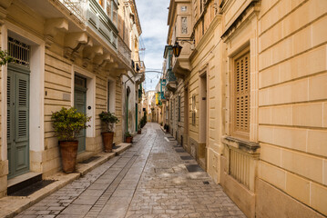 A narrow stone street in the historic city of Mdina on the island of Malta.