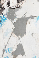 Old grunge torn collage urban street posters creased crumpled paper placard texture background. Ripped faded paper backdrop surface placard