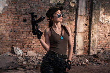 Female soldier with weapons. Character from the comic book The Punisher. Armed with a pistol and machine gun. A dangerous person who solves problems with force.