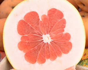 Cross section of a large Pomelo. It is the largest citrus fruit from the family Rutaceae and the principal ancestor of the grapefruit.