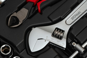 Adjustable wrench in the toolbox.