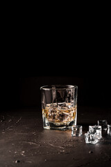 Glass of scotch whiskey on a black background. luxury whiskey.