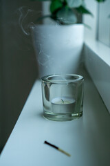 Cozy home interior with smoke from a tea light.