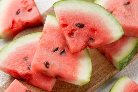 Close up watermelon slices with seeds. Fresh juicy raw fruit