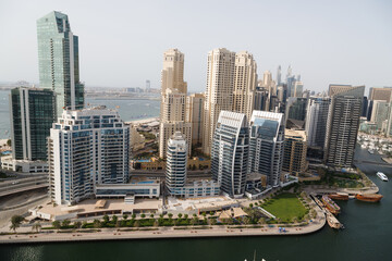 Fototapeta na wymiar View on Dubai Marina skyscrapers and the most luxury superyacht marina,Dubai