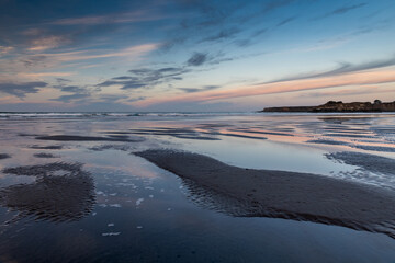 Sunrise and low tide over the beach near the small town of Mendocino, California