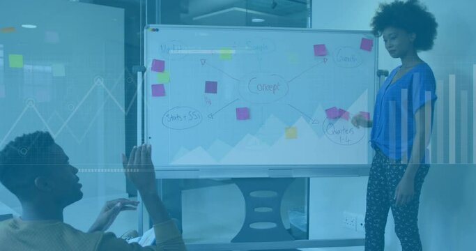 Animation of data processing over african american man and woman discussing over a whiteboard