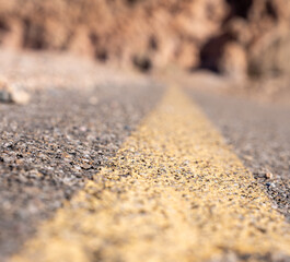 low-angle image of a Paved road in Death Valley California. High quality photo of the artist's Drive in Death Valley National Park. 