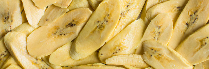 Top view of slices of ripe plantains , slices of yellow plantains for frying, process for making fried plantain