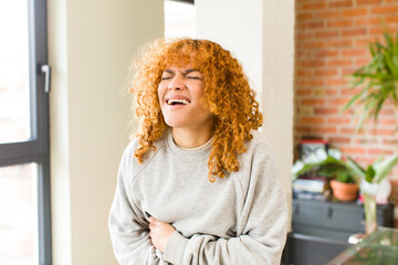 Fototapeta premium young red hair latin pretty womann at new cool home