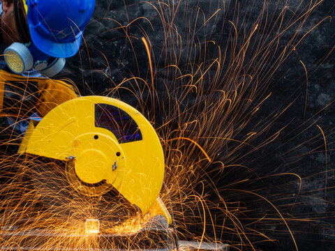 persom electrical spark wheel metal steel contruction welding workshop technology tool iron equipment manufacturing accuracy electric pipe skill drill machanic job  industry concept