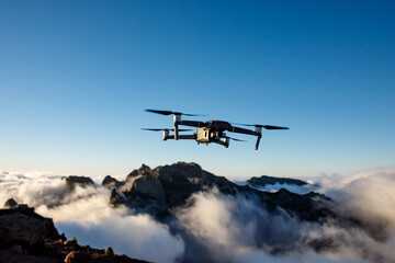 A drone flying over nature and making beautiful pictures and videos.