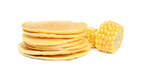 Tasty corn pancakes with cobs on white background