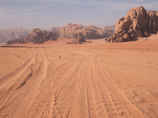 Fototapeta na wymiar Tire Tracks in the sand of Wadi Rum desert, Jordan.