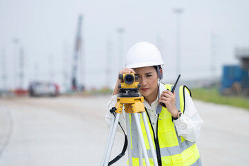 Survey equipment woman engineer. Surveyor's telescope at the construction site or survey for making...