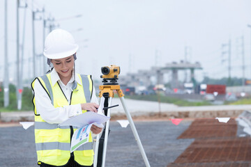 Survey equipment woman engineer. Surveyor's telescope at the construction site or survey for making...