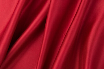 Smooth elegant red silk or satin luxury cloth texture background.