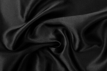 Fototapeta premium Smooth elegant black silk or satin luxury cloth texture background.