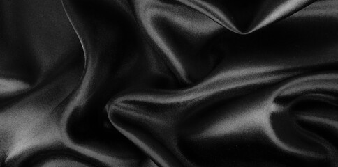 Smooth elegant black silk or satin luxury cloth texture background.