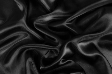 Smooth elegant black silk or satin luxury cloth texture background.