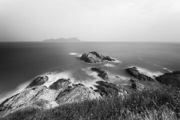 waves crashing on rocks, long exposure, black and white