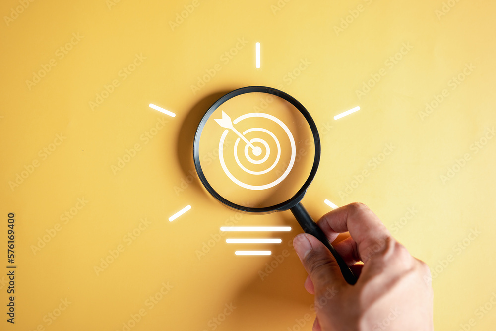 Fototapete Magnifier glass focus to target objective with idea creative light bulb icon. planning development leadership and customer target group concept...