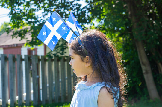 Girl celebrates the national holiday,
Drapeau qu&eacute;bec - Happy Quebec Day
Quebec's National Holiday,
La Fete Nationale du Quebec,
St. Jean-Baptiste