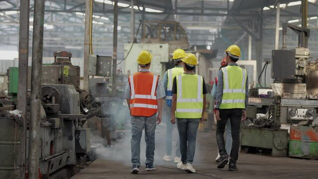 engineers meeting. factory worker people walk and check in warehouse factory. Manager discuss inspection report for internal audit. Quality assurance for manufacturing. Concept Engineer Operating.
