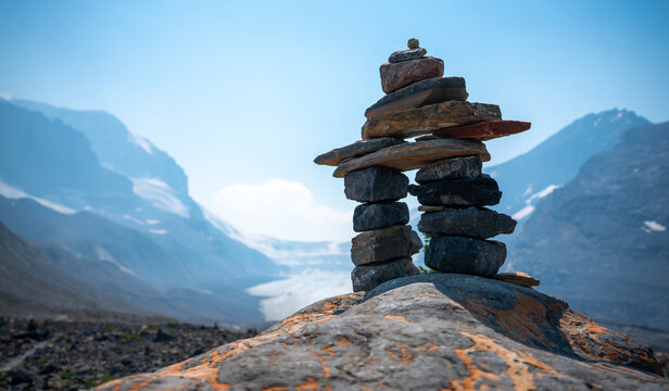 Inspiring Inukshuk landscape in Canadian rockies. 