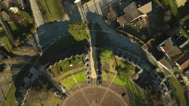 Top down drone dolley shot of the Augusta Raurica roman theater on a sunny day
