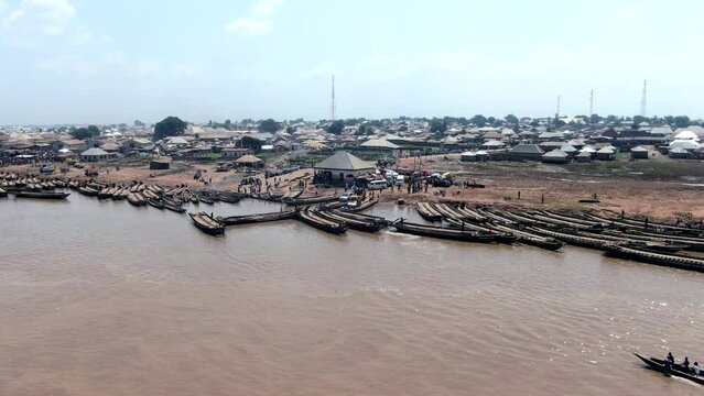 Long wooden rafts used to ferry people and vehicles across the Benue River near Ibi Town, Nigeria