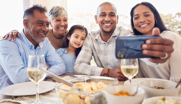 Black family selfie, lunch and smile in home with men, women and girl at table for celebration on web app. Man, smartphone photography and profile picture for social media with kid, parents and woman