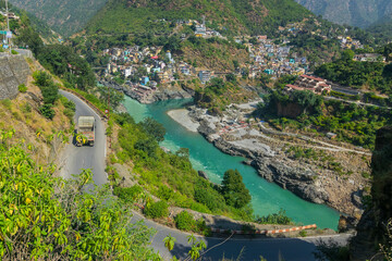 Fototapeta na wymiar Curvy road at Devprayag, Godly Confluence,Garhwal,Uttarakhand, India. Here Alaknanda meets the Bhagirathi river and both rivers thereafter flow on as the Holy Ganges river or Ganga.
