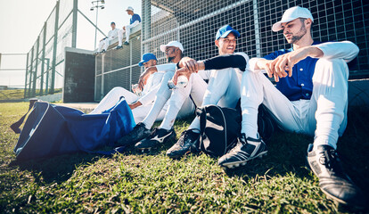 Baseball team, sitting and grass for training, relax and conversation with men, sports or solidarity. Man, friends and sport with teamwork, diversity and talk for match, game or competition in summer
