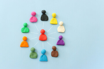Colorful figures connected over blue background, concept of human resources and collaboration