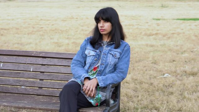 Sad Lonely South Asian Girl Sitting On The Bench Alone