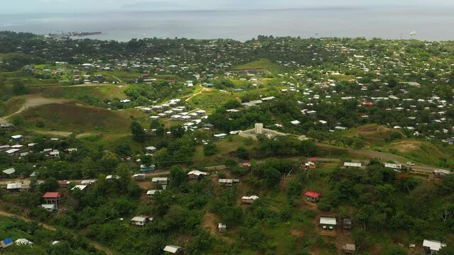 Aerial panning view from the hills looking west to Honiara city and seaport.
