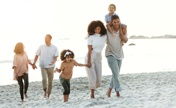 Latino Family, Beach And Walking On Summer Vacation, Quality Time And Bonding For Fun And Wellness. Grandparents, Mother And Father With Children, Seaside Holiday And Travelling For Adventure And Joy