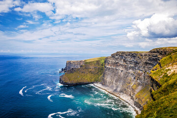 Fototapeta premium Spectacular Cliffs of Moher are sea cliffs located at the southwestern edge of the Burren region in County Clare, Ireland. Wild Atlantic way