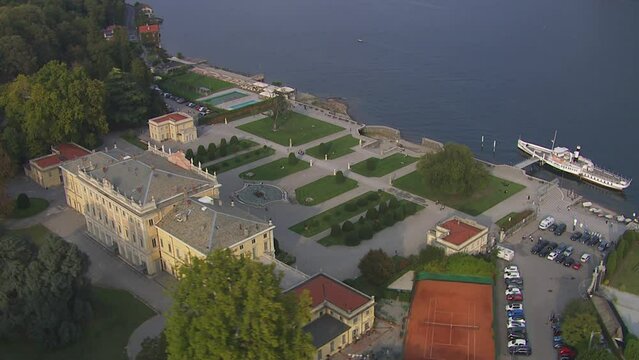 Aerial rotating shot of Villa Olmo with a spectacular view of lake Como in Italy
