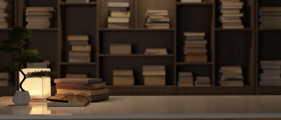 Close-up image of copy space on table over blurred background of large bookshelves. library at night