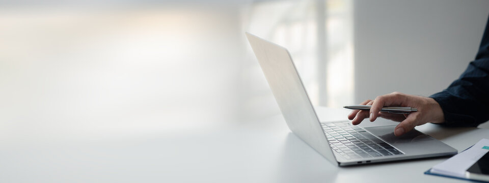 Businessman working, businessman looking at business documents and checking company finances, young startup company executive. Startup business management concept.