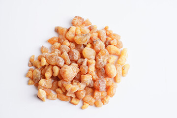 Frankincense or olibanum aromatic resin isolated on white background used in incense and perfumes.